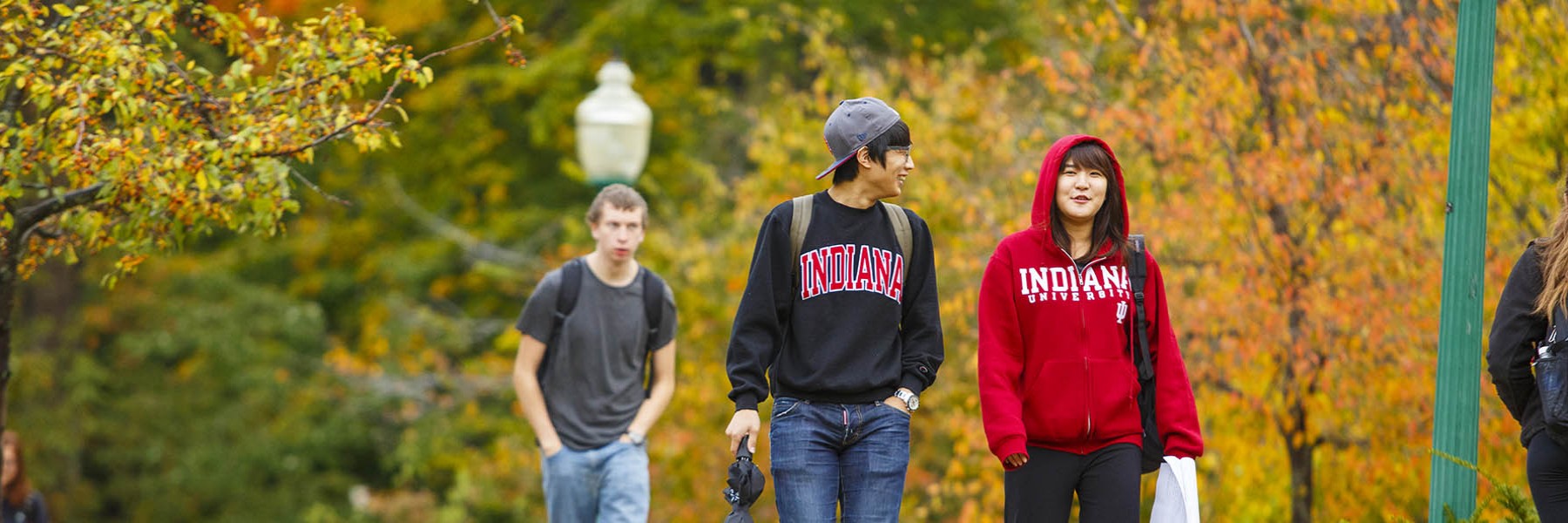 Students walk across IU's campus in Indiana apparel