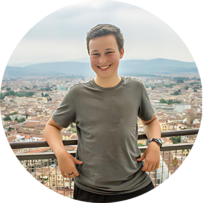 Leo Mohlke smiling and standing by an overlook over the city of Florence, Italy.